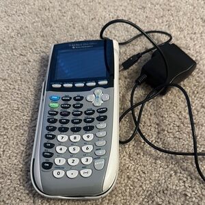 Texas Instruments TI-84 Plus C Silver Graphing Calculator with Charger.